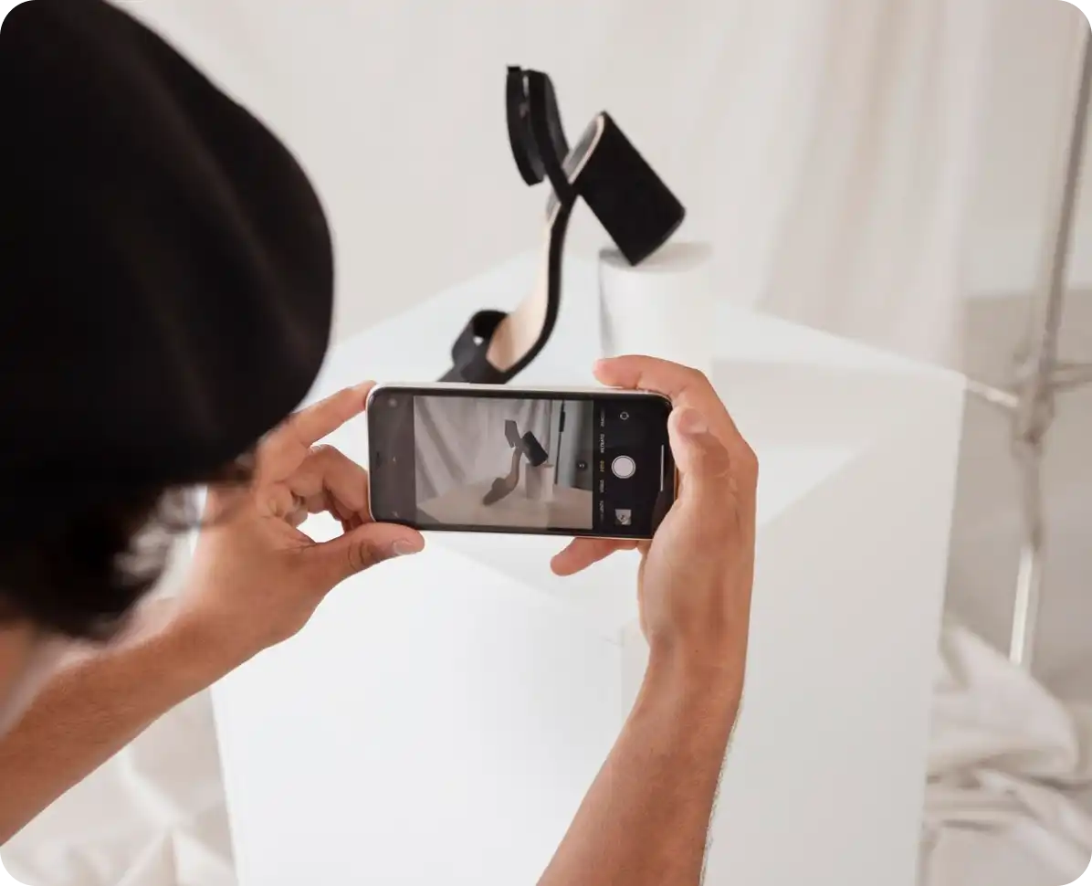 Person recording video with smartphone